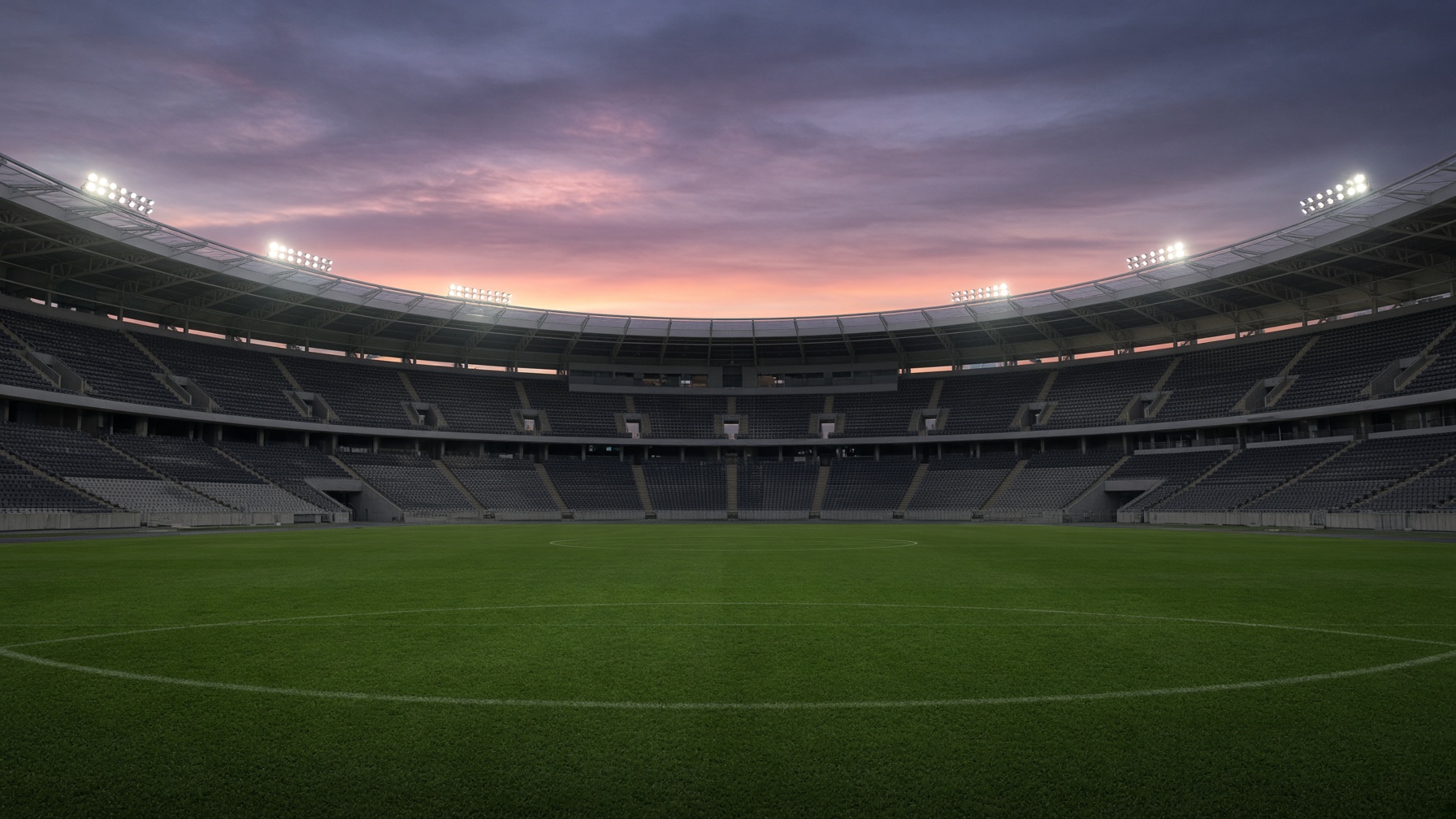 Floodlights over a large Nigerian football stadium at twilight